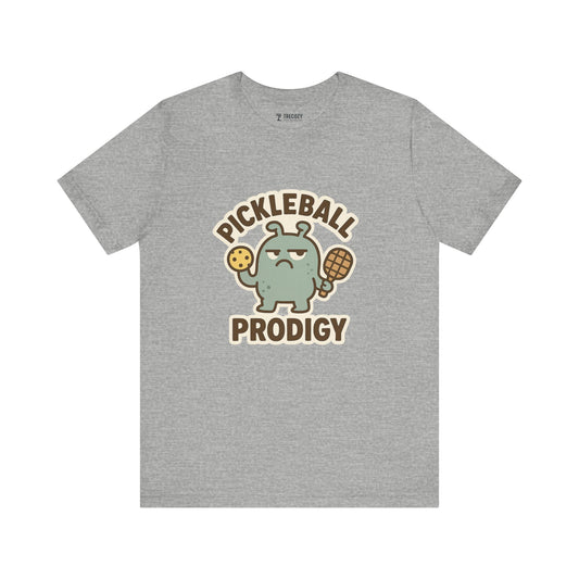 Pickleball Prodigy – Funny Pickleball Monster T-Shirt, Quirky Sports Cartoon Graphic Tee