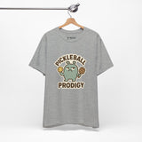 Pickleball Prodigy – Funny Pickleball Monster T-Shirt, Quirky Sports Cartoon Graphic Tee