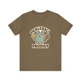 Pickleball Prodigy – Funny Pickleball Monster T-Shirt, Quirky Sports Cartoon Graphic Tee